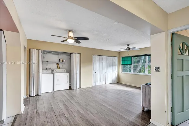 a view of a house with swimming pool and sitting area