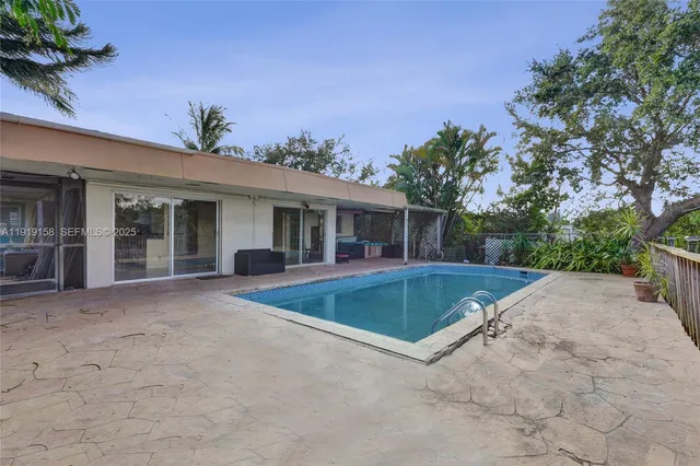 a view of outdoor space with wooden floor