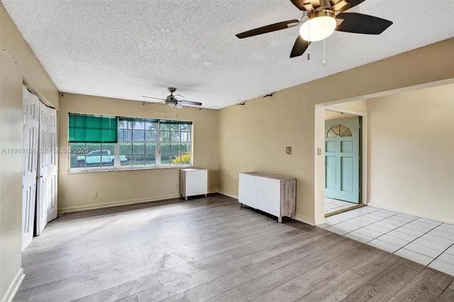 a view of kitchen with window and wooden floor