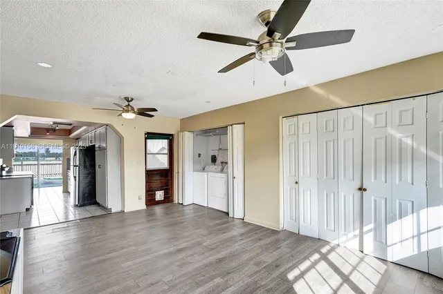 a view of an entryway with wooden floor