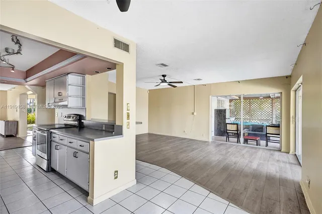 a kitchen with stainless steel appliances granite countertop a sink and cabinets