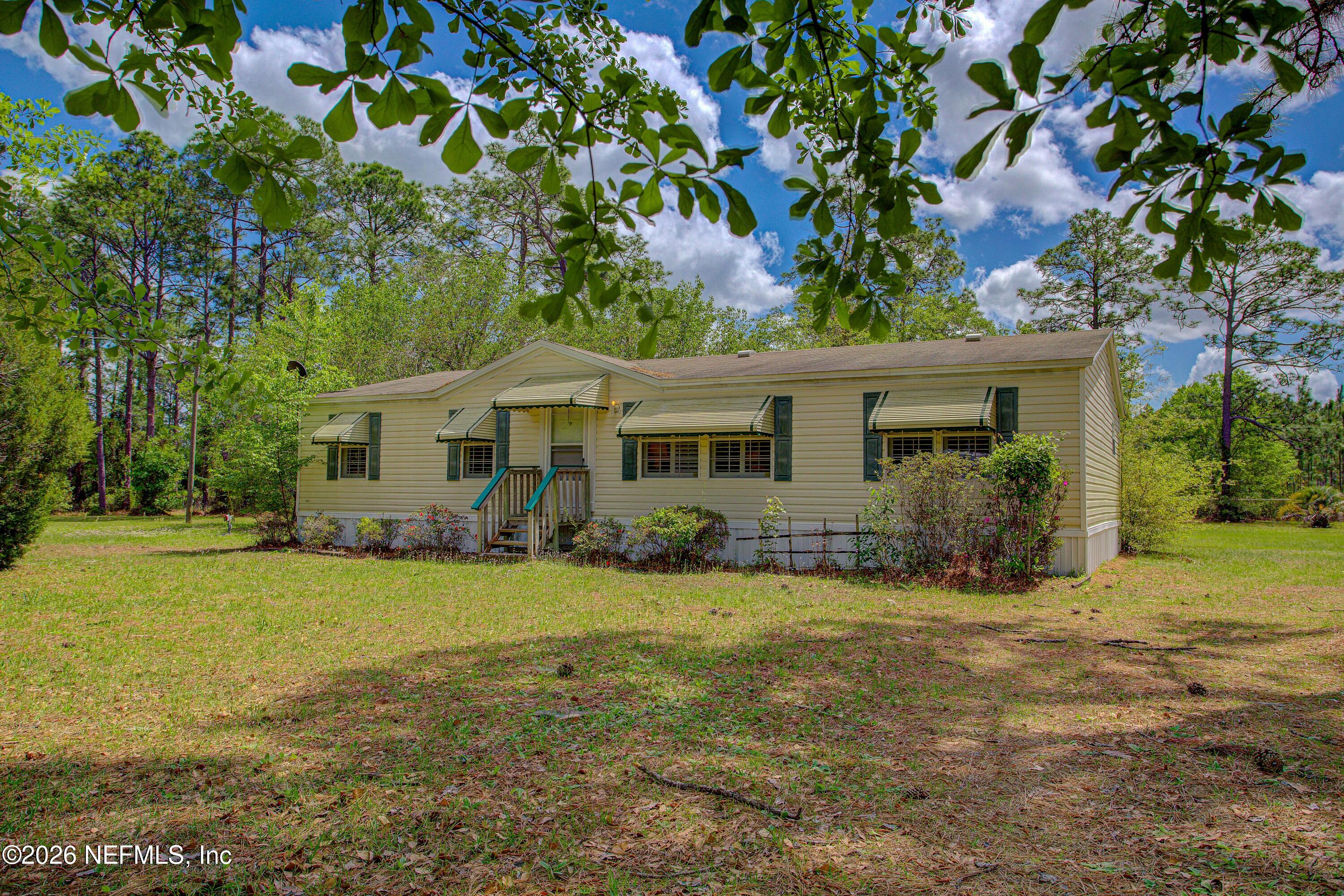 28050 Roundup Place Hilliard, FL 32046 - Photo 1 of 43 20260402-28050_Roundup_Pl-22