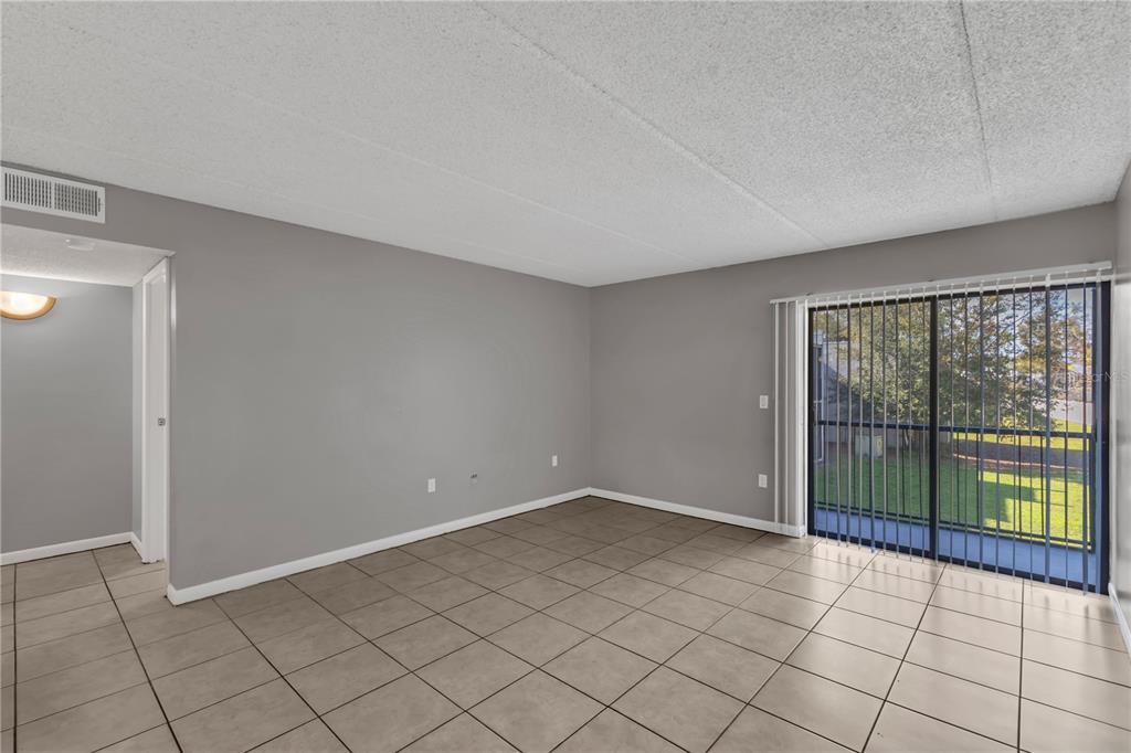 1108 Bartow Road, Unit D37 Lakeland, FL 33801 - Photo 9 of 16 a view of an empty room with window