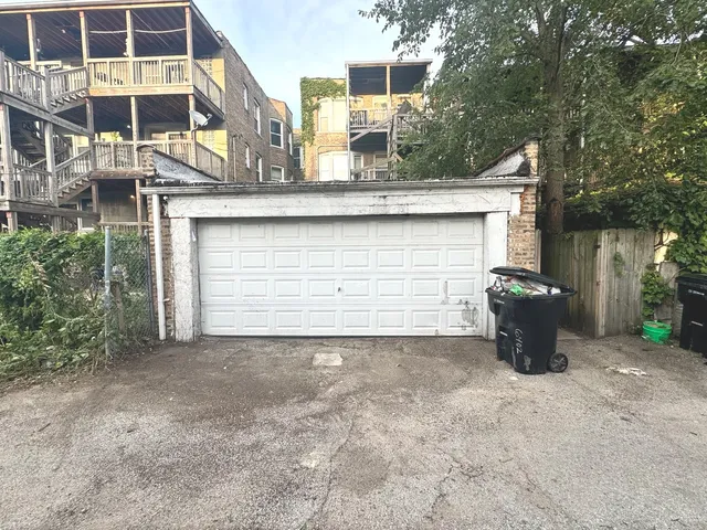 a view of a blue house with large outdoor space