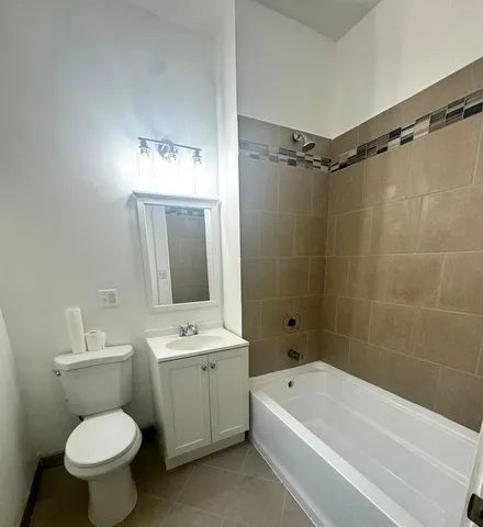 a bathroom with a sink toilet a shower and bathtub