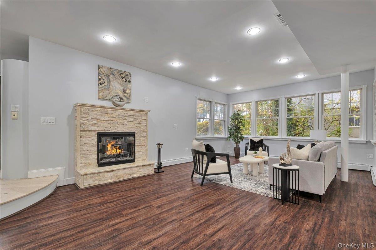 193 Nelson Road Scarsdale, NY 10583 - Photo 12 of 37 a living room with furniture and a fireplace