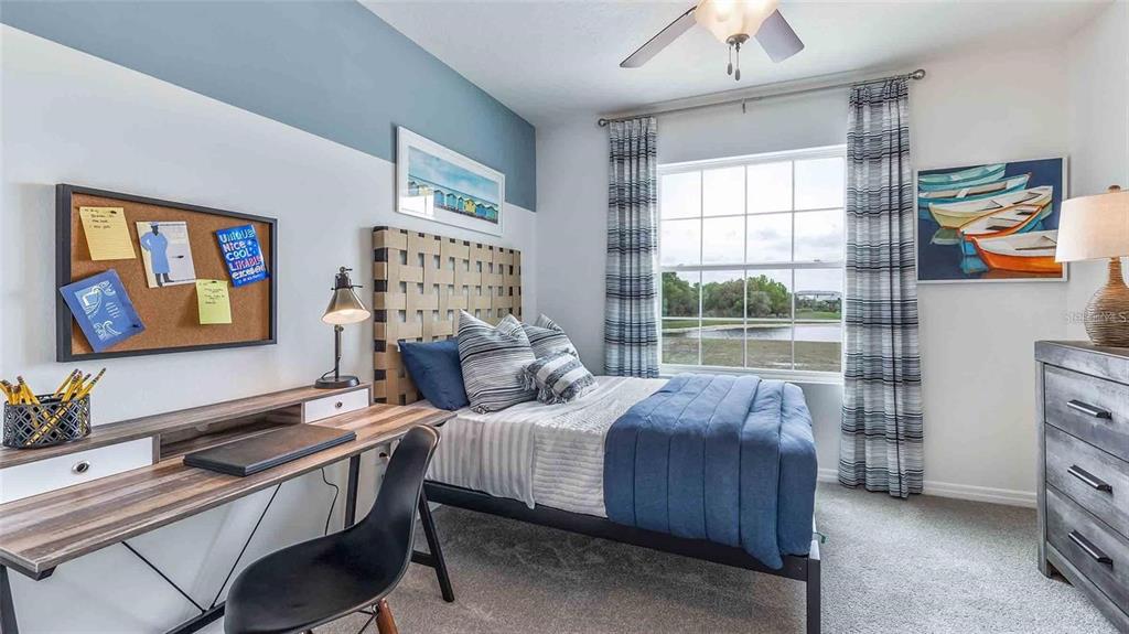 32311 Turtle Grace Loop Wesley Chapel, FL 33545 - Photo 10 of 23 a bedroom with a bed and a window