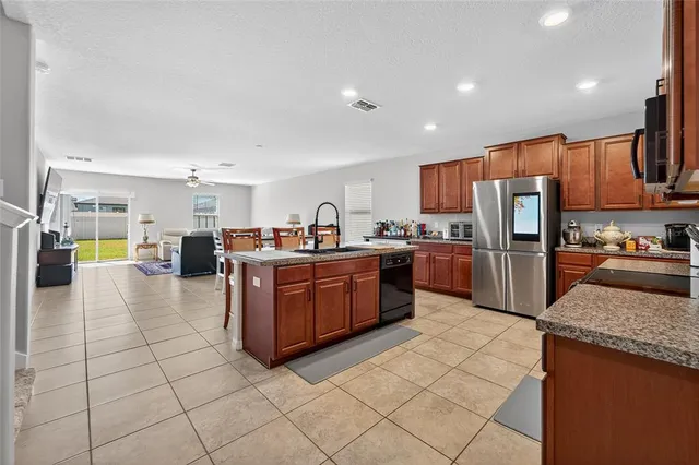 a kitchen with stainless steel appliances lots of counter top space