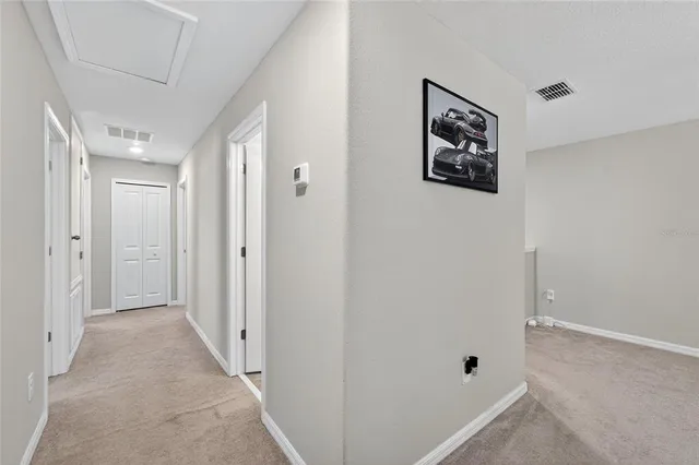 a view of a hallway with front door