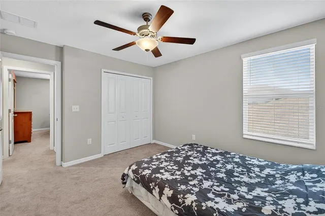 a bedroom with bed and window