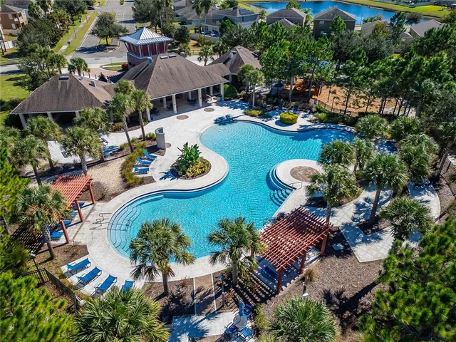 an aerial view of a house with garden space and street view