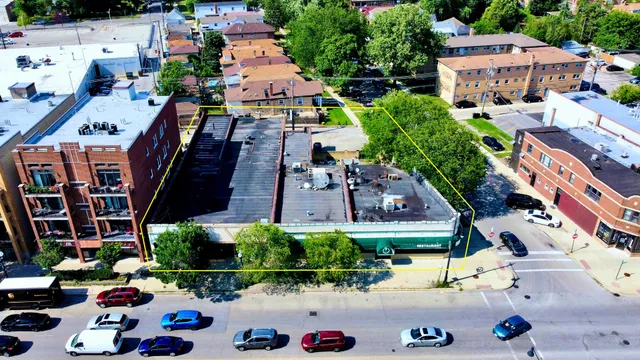 a sign that is sitting in front of flowers