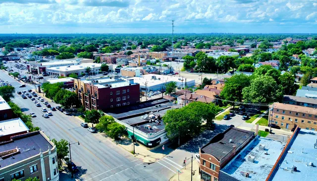 an aerial view of a houses with yard