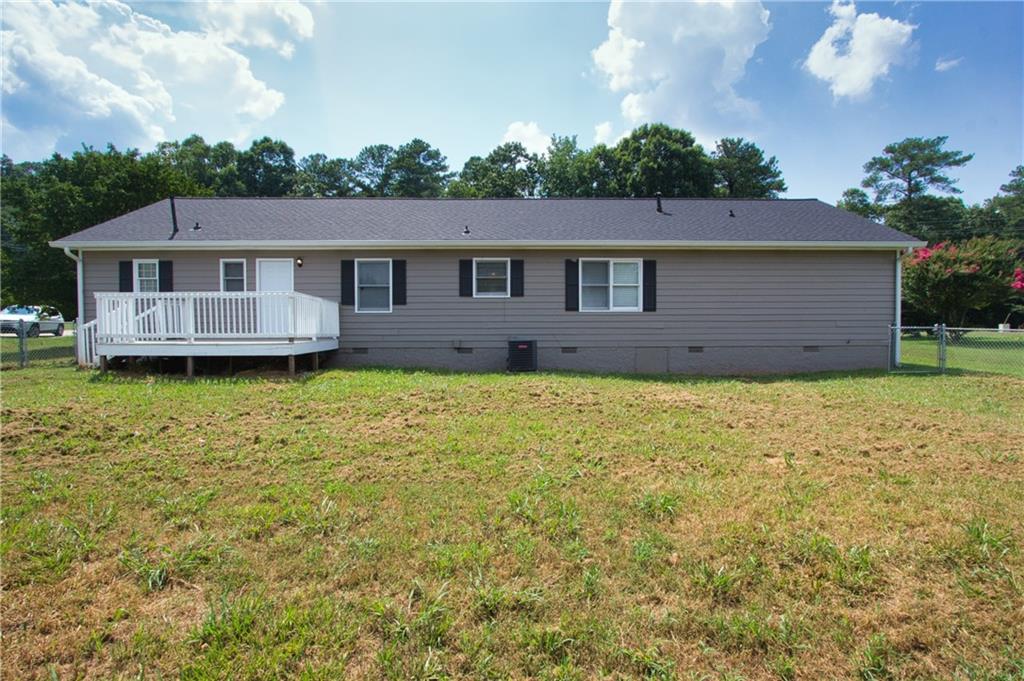 374 McGiboney Road Covington, GA 30016 - Photo 28 of 29 a view of a house with a big yard plants and large trees