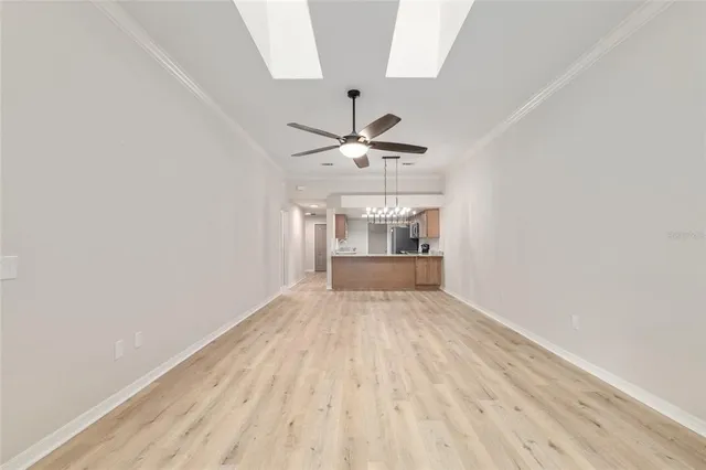 a bathroom with a granite countertop double vanity sink and a mirror