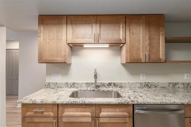 a bathroom with a double vanity sink and mirror