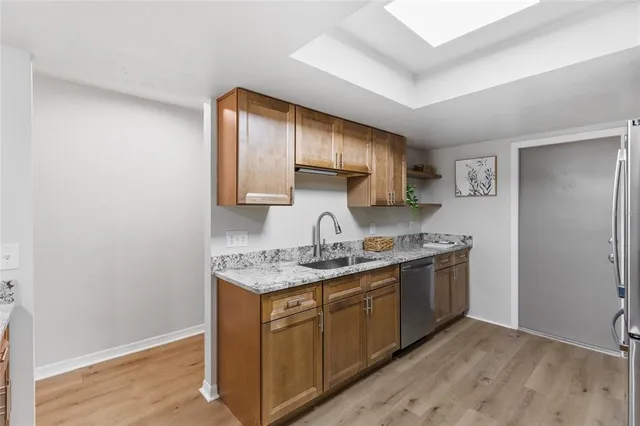 a view of entryway with wooden floor and front door