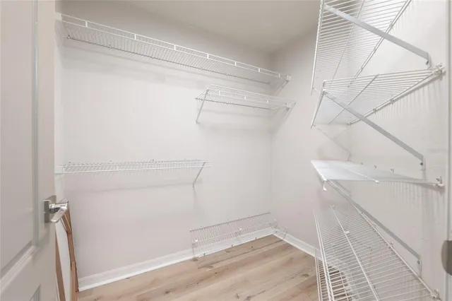 a view of a house with a tree in the background