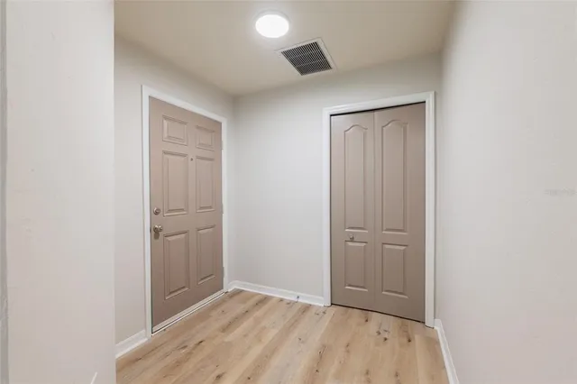 a kitchen with stainless steel appliances granite countertop a sink a stove top oven and cabinetry