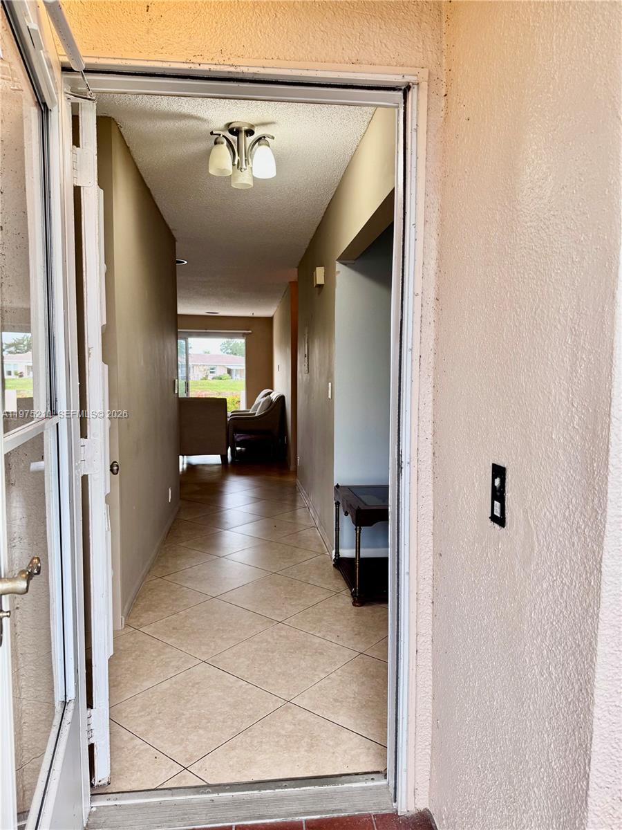 8838 Bella Vista Drive Boca Raton, FL 33433 - Photo 2 of 11 a view of a hallway view with living room