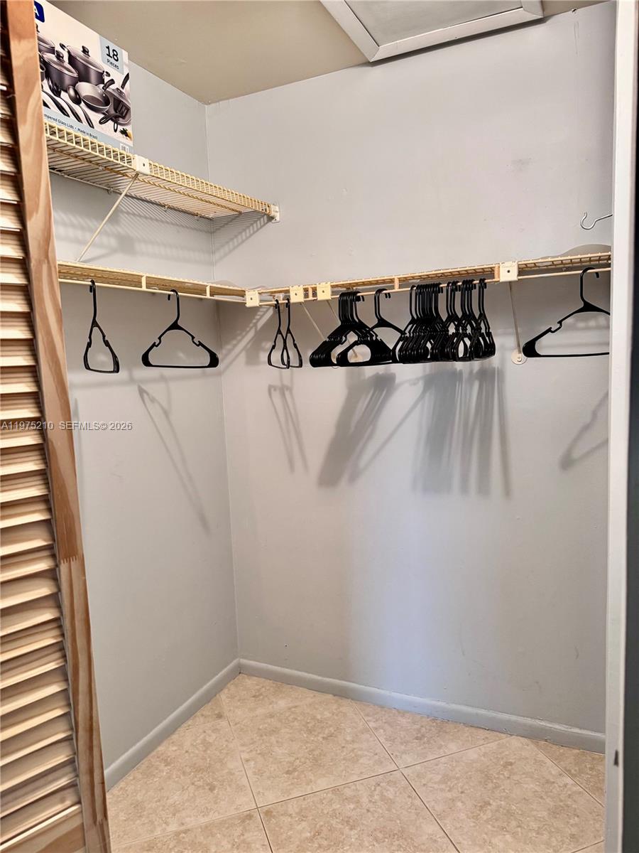 8838 Bella Vista Drive Boca Raton, FL 33433 - Photo 9 of 11 a view of a walk in closet