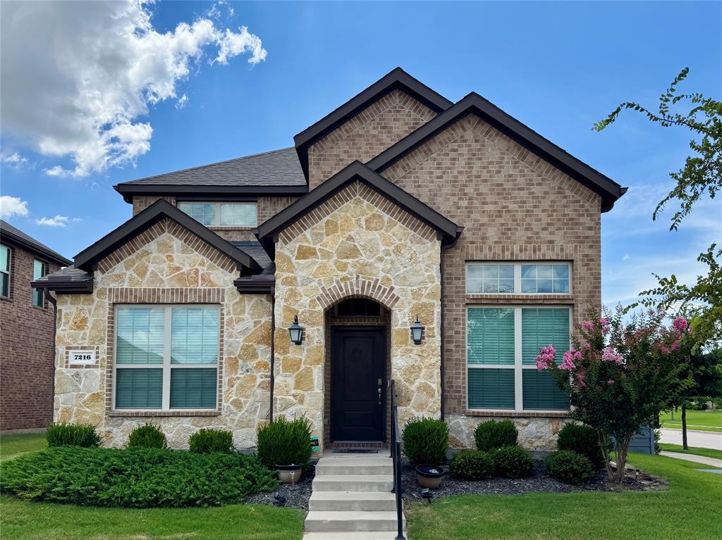 7216 Wildflower Way Little Elm, TX 76227 - Photo 1 of 22 a front view of a house with garden