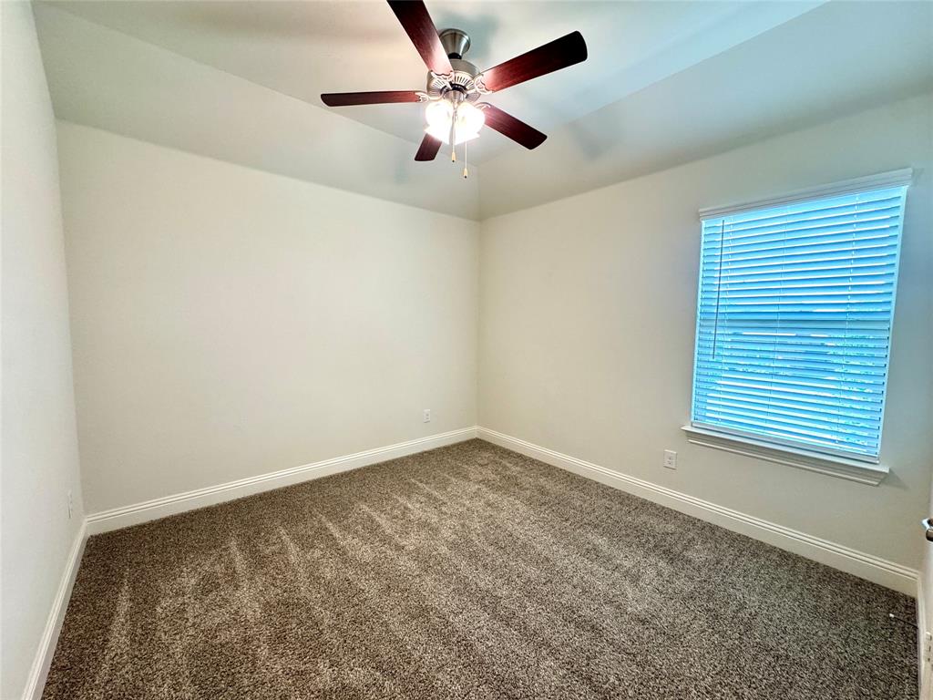7216 Wildflower Way Little Elm, TX 76227 - Photo 16 of 22 wooden floor in an empty room with a window