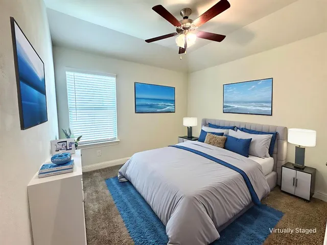 a bedroom with bed and window