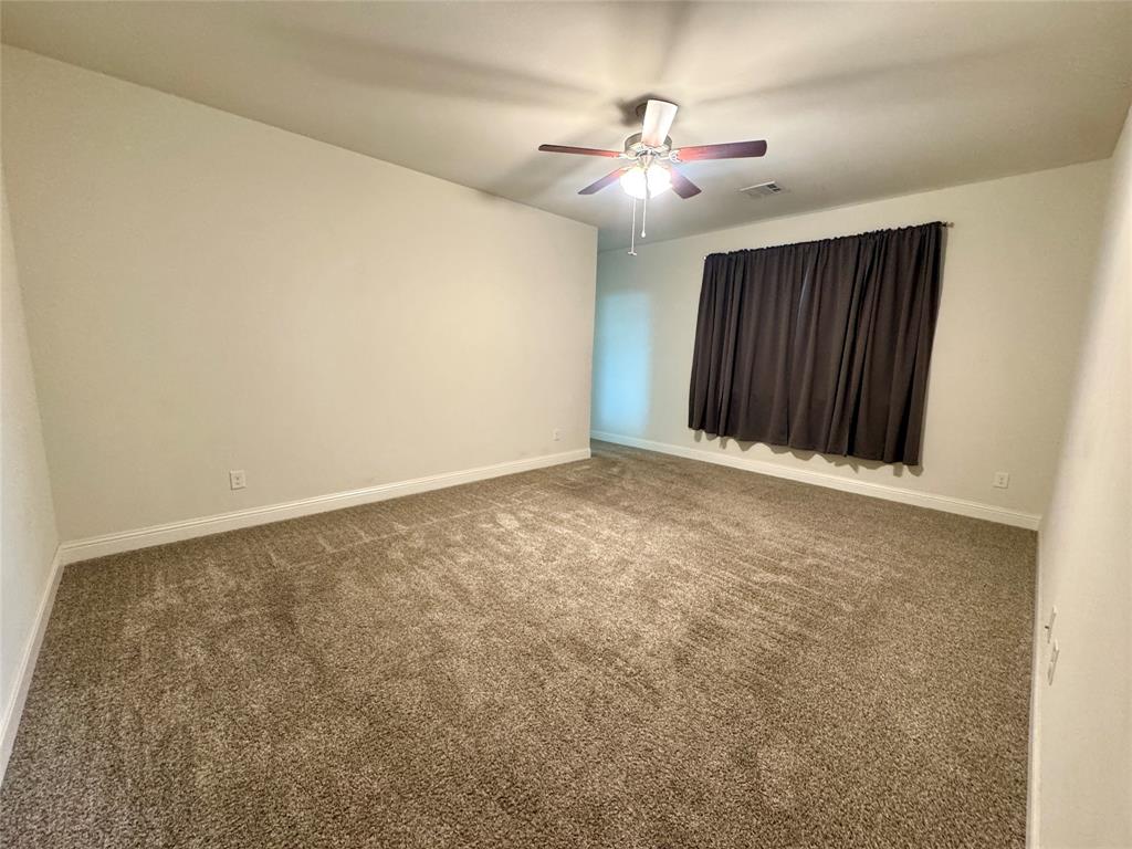 7216 Wildflower Way Little Elm, TX 76227 - Photo 6 of 22 an empty room with chandelier fan