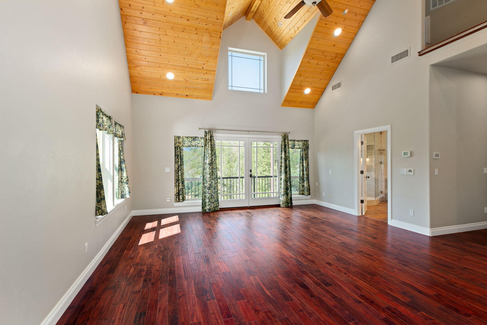 7304 North Applegate Road Grants Pass, OR 97527 - Photo 28 of 87 wooden floor in an empty room with a window