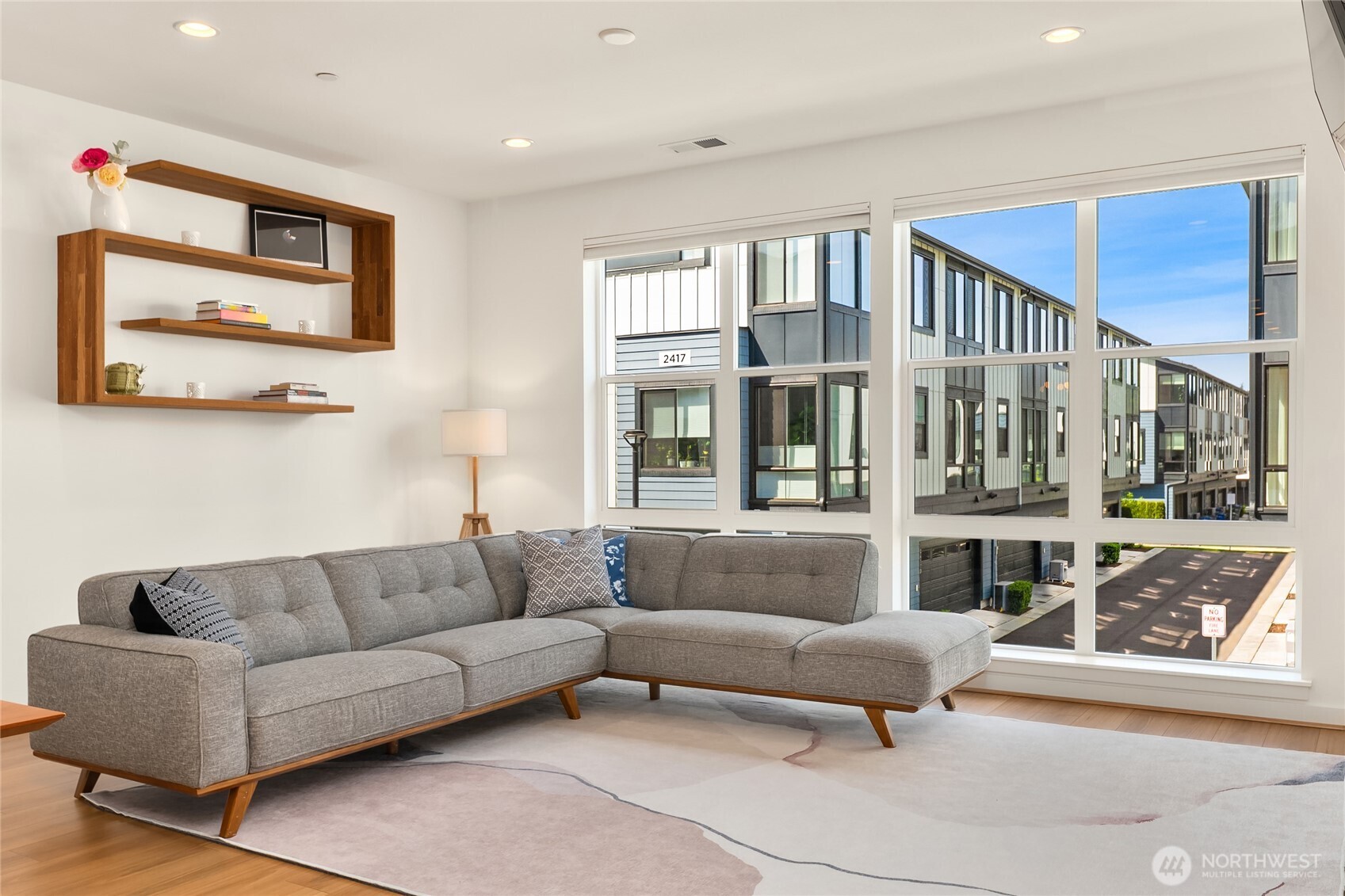 21907 25th Avenue Southeast, Unit C Bothell, WA 98021 - Photo 21 of 40 a living room with furniture and a large window