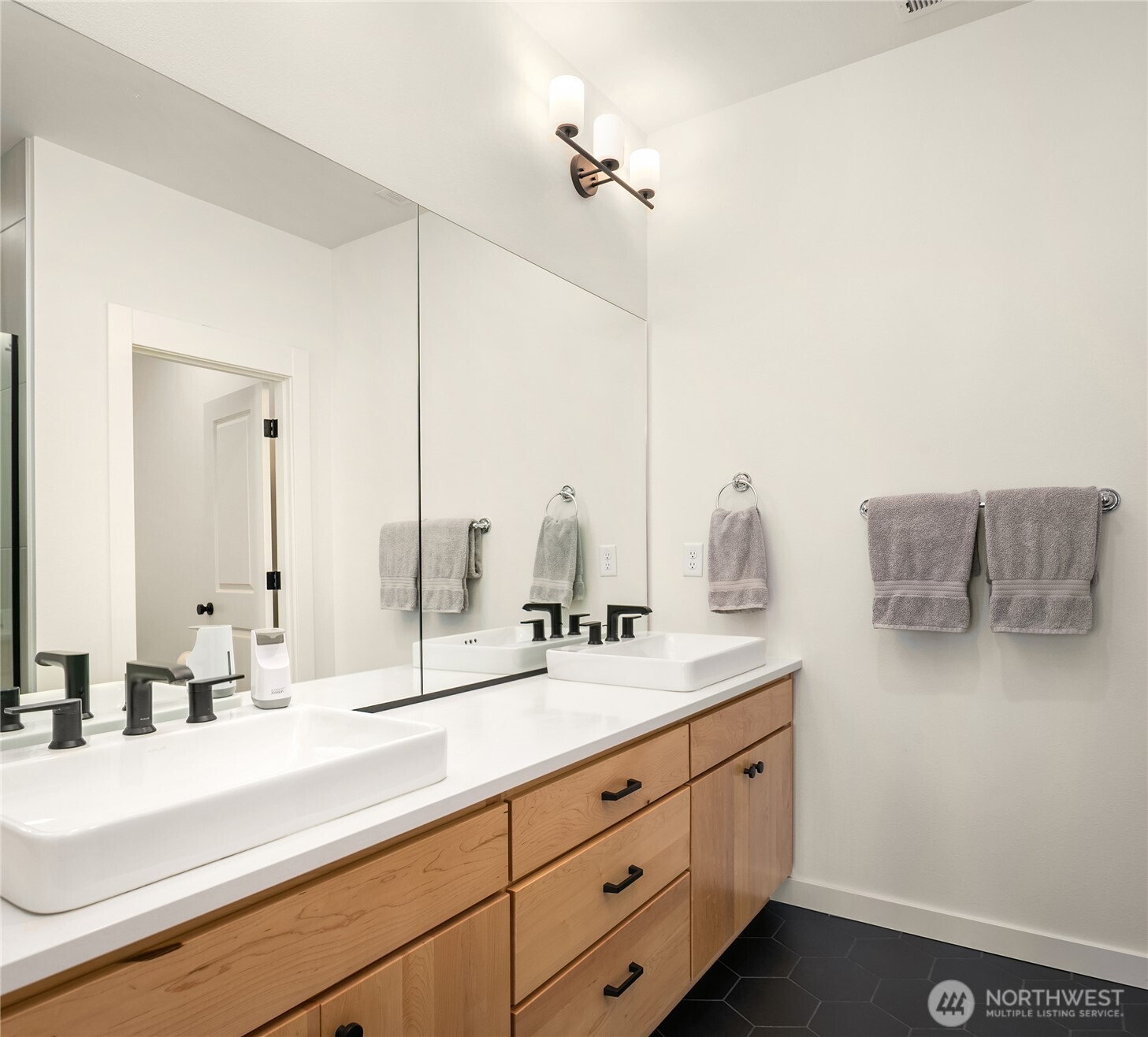 21907 25th Avenue Southeast, Unit C Bothell, WA 98021 - Photo 27 of 40 a bathroom with a double vanity sink and mirror