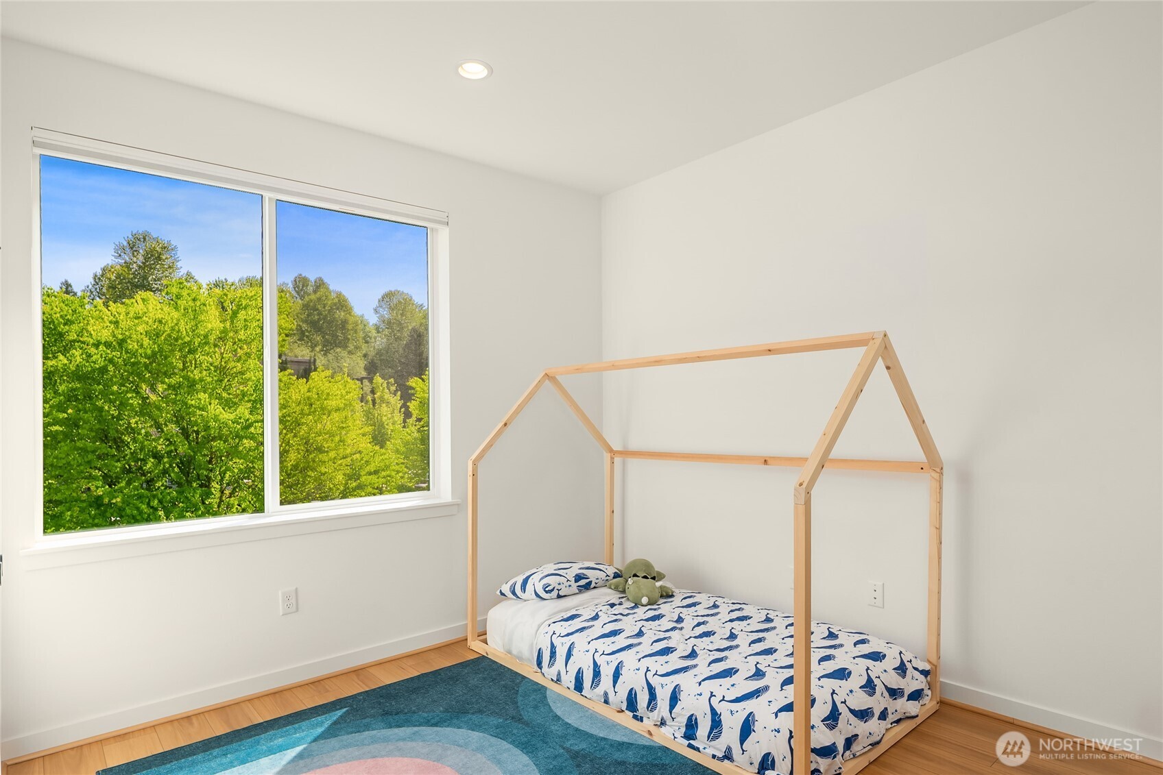 21907 25th Avenue Southeast, Unit C Bothell, WA 98021 - Photo 31 of 40 a bedroom with a bed and a window