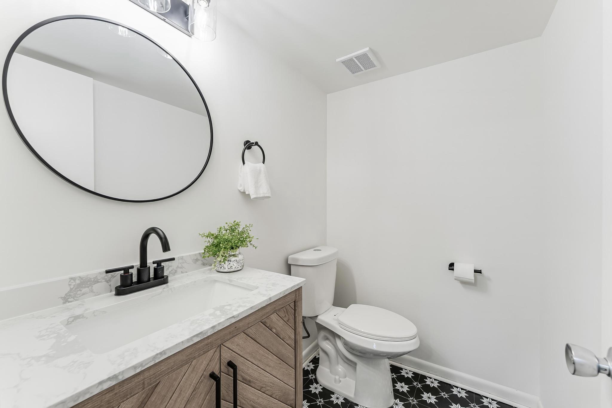 12023 Insha Court Reston, VA 20191 - Photo 10 of 52 a bathroom with a toilet sink and mirror