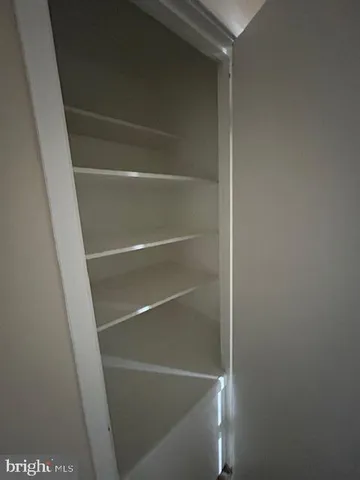 a view of an empty walk in closet