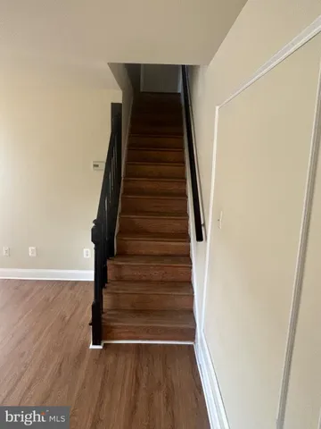 a white toilet sitting next to a bathroom sink