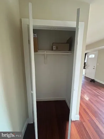 a view of room with wooden floor