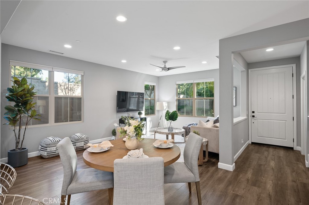 84 Granite Path Irvine, CA 92620 - Photo 12 of 55 a view of a dining room with furniture window and wooden floor