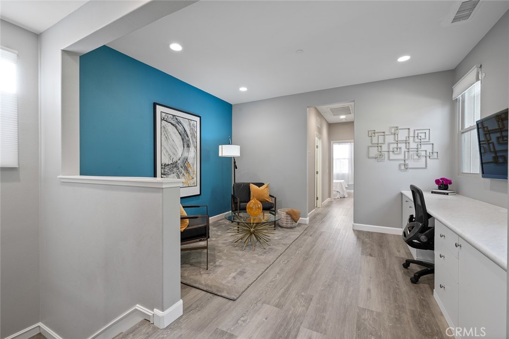 84 Granite Path Irvine, CA 92620 - Photo 20 of 55 a living room with furniture and a flat screen tv