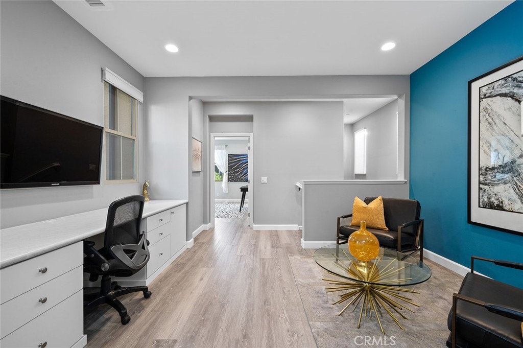 84 Granite Path Irvine, CA 92620 - Photo 24 of 55 a living room with furniture and a flat screen tv