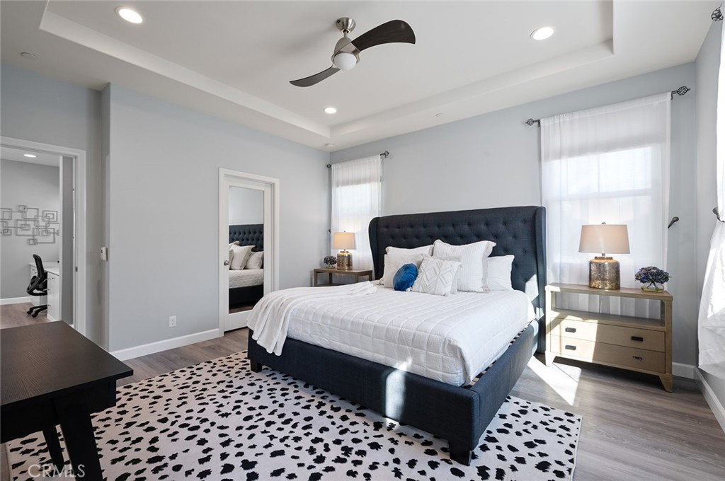 84 Granite Path Irvine, CA 92620 - Photo 26 of 55 a bedroom with a bed and a lamp on dresser