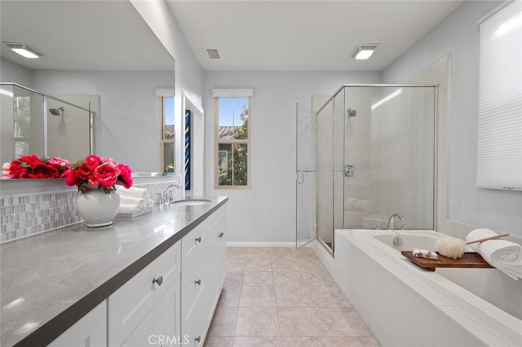 84 Granite Path Irvine, CA 92620 - Photo 30 of 55 a bath room with sink and mirror