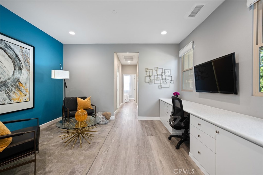 84 Granite Path Irvine, CA 92620 - Photo 32 of 55 a living room with furniture and a flat screen tv