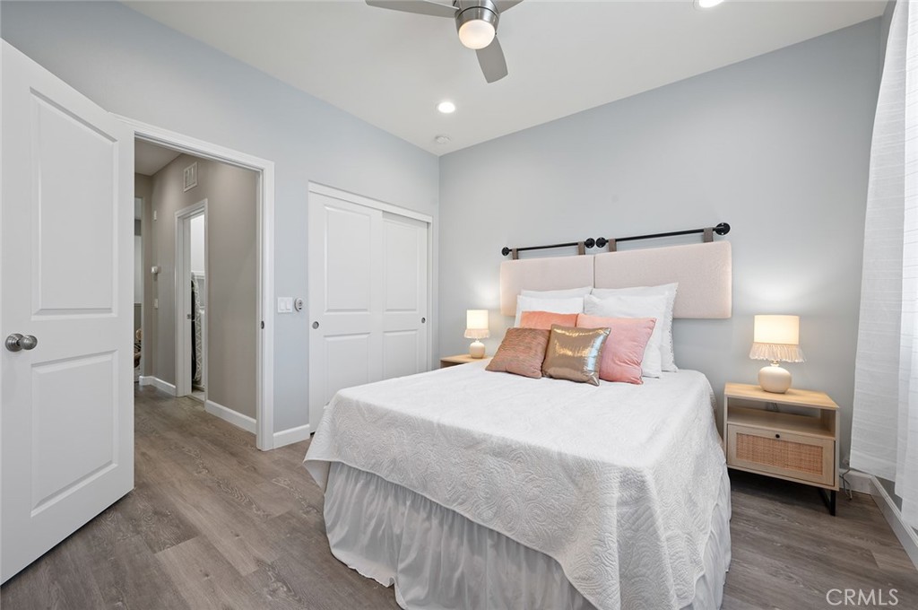 84 Granite Path Irvine, CA 92620 - Photo 34 of 55 a bedroom with a bed and a chandelier