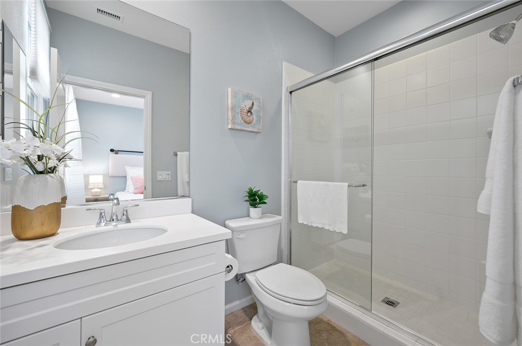 84 Granite Path Irvine, CA 92620 - Photo 36 of 55 a bathroom with a sink toilet and shower