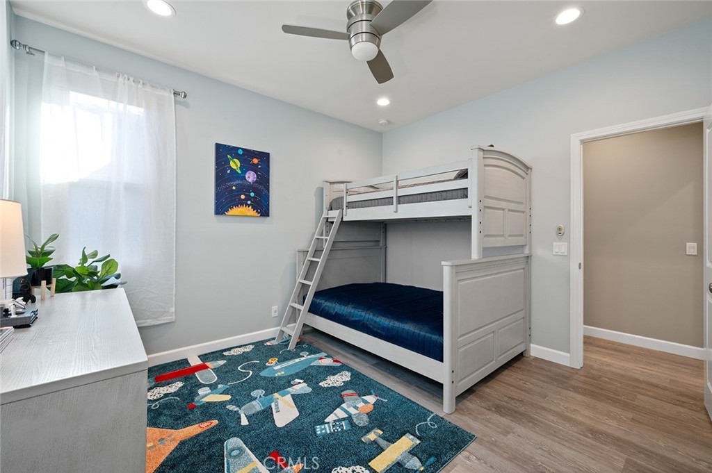 84 Granite Path Irvine, CA 92620 - Photo 37 of 55 a living room with furniture and a baby crib