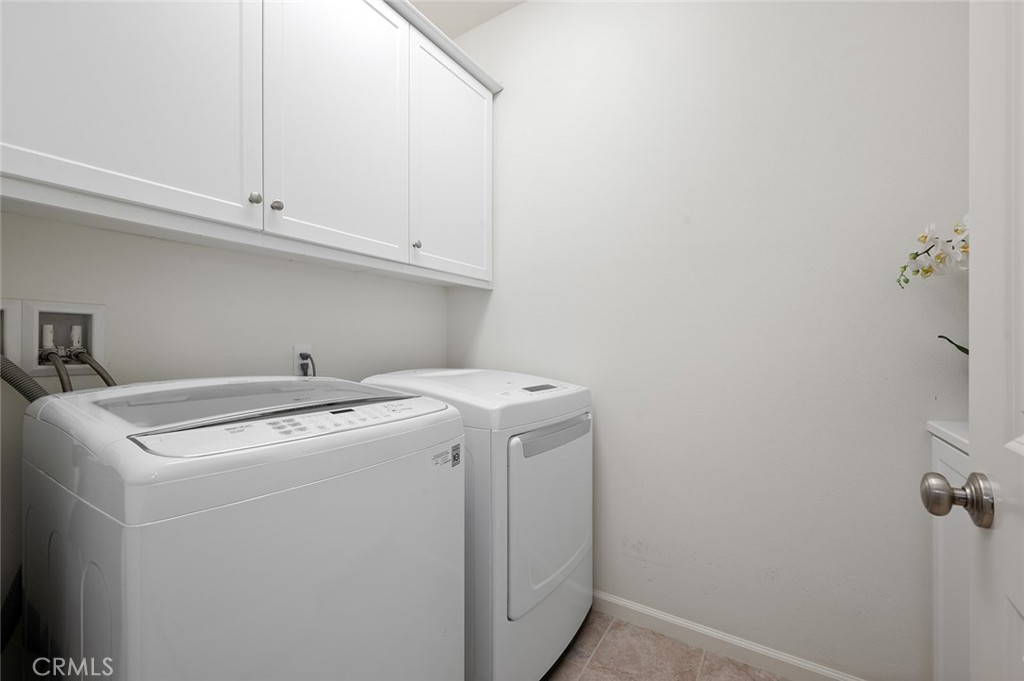 84 Granite Path Irvine, CA 92620 - Photo 40 of 55 a utility room with dryer and washer