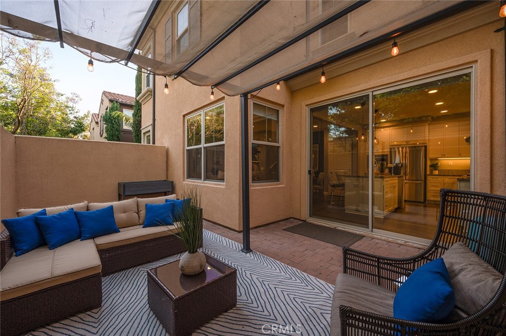 84 Granite Path Irvine, CA 92620 - Photo 44 of 55 a outdoor living space with furniture and a potted plant