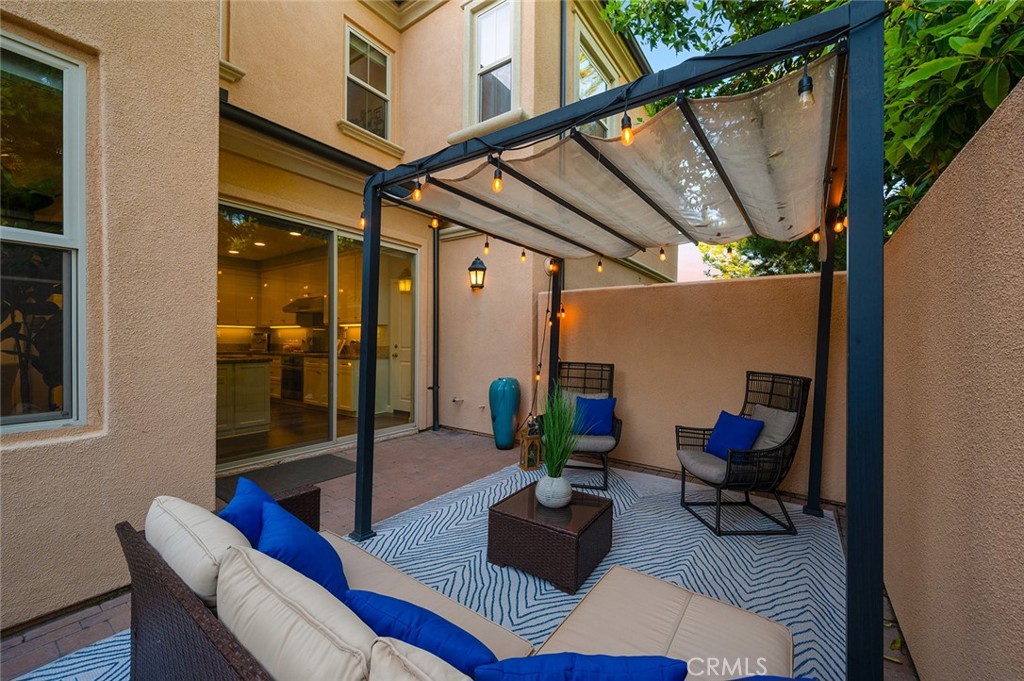 84 Granite Path Irvine, CA 92620 - Photo 45 of 55 a living room with furniture and a potted plant
