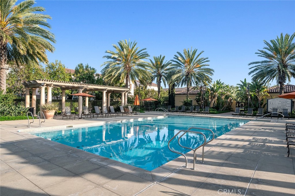 84 Granite Path Irvine, CA 92620 - Photo 48 of 55 a front view of house with yard and palm tree